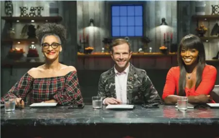  ??  ?? Carla Hall, Zac Young and Lorraine Pascale as seen in “Halloween Baking Championsh­ip”