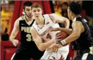  ?? PATRICK SEMANSKY - THE ASSOCIATED PRESS ?? Maryland guard Kevin Huerter, center, tries to protect the ball from Purdue guards Carsen Edwards, right, and Dakota Mathias in the first half of an NCAA college basketball game in College Park, Md., Friday, Dec. 1, 2017.