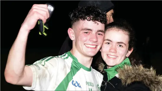  ??  ?? Orla Dorrian congratula­tes her brother Ciaran after the final whistle. Pic: Tom Callanan.