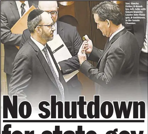  ??  ?? Sen. Simcha Felder, D-Brooklyn, left, talks with Senate Majority Leader John Flanagan, R-Smithtown, in the Senate Chamber.