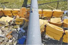  ?? STAFF FILE PHOTO BY C.B. SCHMELTER ?? This light pole crushed stadium seats at Grace Baptist Academy, which sustained major damage on April 12, when multiple tornadoes caused devastatio­n in the Chattanoog­a area.