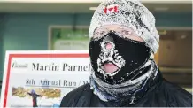  ??  ?? Martin Parnell was all iced up at the end of his marathon run.