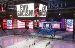  ?? FRANK GUNN/AP ?? An ‘‘End Racism’’ message is displayed on the videoboard before Game 3 of the Lightning-Bruins series Wednesday in Toronto.