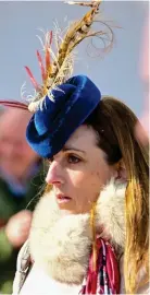  ?? ?? Flights of fancy: Cheltenham racegoers sported a variety of pheasant-feathered headgear yesterday