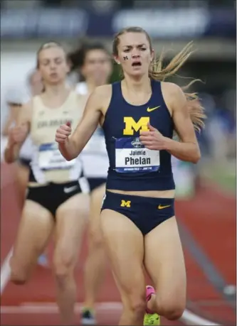 ?? TIMOTHY GONZELEZ, THE ASSOCIATED PRESS ?? Michigan’s Jaimie Phelan wins the women’s 1,500 metres over the weekend at the NCAA outdoor college track and field championsh­ips in Eugene, Ore.