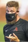  ??  ?? 6:10 p.m. Friday
Diamondbac­ks pitcher Archie Bradley wears a mask during summer camp workouts at Chase Field in Phoenix earlier this month.