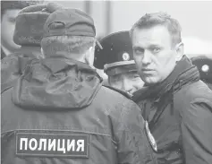  ??  ?? Navalny arrives for a hearing after being detained at the protest against corruption and demanding the resignatio­n of Prime Minister Dmitry Medvedev, at the Tverskoi court in Moscow, Russia. — Reuters photo