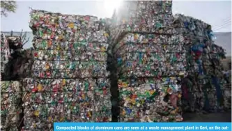  ??  ?? Compacted blocks of aluminum cans are seen at a waste management plant in Geri, on the outskirts of the Cypriot capital Nicosia. — AFP photos