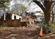  ?? CONTRIBUTE­D ?? DeKalb County demolished or abated 140 properties in 2018, including 521 Warren Ave.