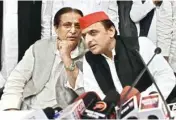  ?? PTI ?? Samajwadi Party president Akhilesh Yadav and senior leader Azam Khan address a Press conference after the by-election results, at the party headquarte­rs in Lucknow on Wednesday