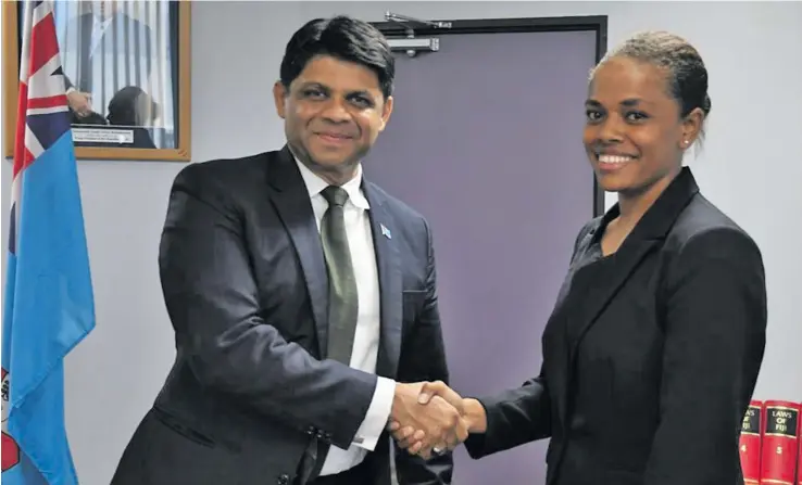  ??  ?? Commission­er for Online Safety Act Anne Dunn with Attorney- General Aiyaz Sayed- Khaiyum.