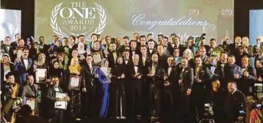  ?? PIC BY ZULFADHLI ZULKIFLI I ?? Deputy Prime Minister Datuk Seri Dr Ahmad Zahid Hamidi with The ONE Awards recipients in Kuala Lumpur yesterday.