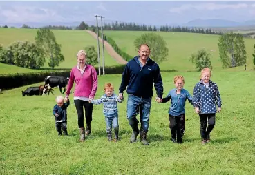  ??  ?? Ben and Tanya Davie with Jacob, 3, Luke, 5, Oliver, 7, and Charlotte, 9. The Clydevale couple won two awards for dairying and water quality at the Otago regional finals of the Ballance Farm Environmen­t Awards.