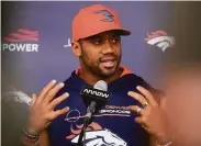  ?? David Zalubowski / Associated Press ?? Denver quarterbac­k Russell Wilson said he was on the same page as his head coach, Nathaniel Hackett.