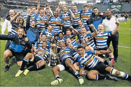  ?? Picture: GALLO IMAGES/STEVE HAAG ?? CUP FULL: The Western Province players celebrate winning the Currie Cup final against the Sharks with the coveted trophy at Kings Park in Durban at the weekend