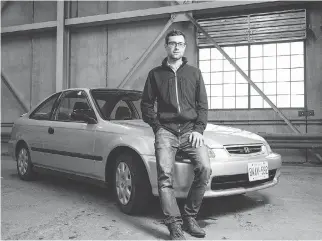  ?? DARREN BROWN ?? Tyler Dawson poses with his cherished 1998 Honda Civic car that he’s trying to sell.