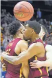  ?? JOHN AMIS/ASSOCIATED PRESS ?? Loyola-Chicago’s Marques Townes, left, is embraced by teammates during the Ramblers’ win over Nevada on Thursday.