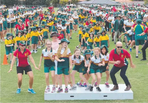  ?? Picture: GLENN HAMPSON ?? A.B. Paterson College attempted a Nutbush dance-off world record and scored a national record for The Twist.