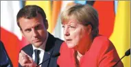  ?? CHARLES PLATIAU / REUTERS ?? French President Emmanuel Macron and German Chancellor Angela Merkel attend a news conference in Paris on Aug 28.