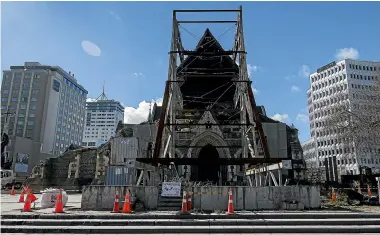  ??  ?? The front of the Christ Church Cathedral has been largely tamed of rubble and overgrowth but the inside might still be home to many a wild creature.