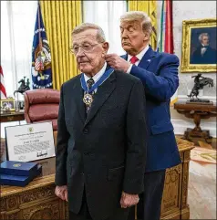  ?? DOUG MILLS/ POOL/ CNP/ ABACA PRESS/ TNS ?? President Donald Trump presents the Medal of Freedom to Lou Holtz i n the Oval Office of the White House on Thursday. “I never made a block or a tackle, but I did try to teach people to make good choices,” Holtz said.