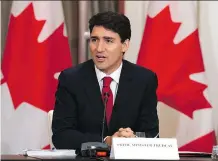  ?? ADRIAN WYLD/THE CANADIAN PRESS ?? Prime Minister Justin Trudeau meets with some members of the business community Tuesday in Singapore.