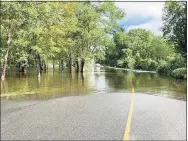  ?? Contribute­d photo ?? The Falls River in Essex flooded some 75 feet onto Falls River Drive following storm Ida, making it impassable.