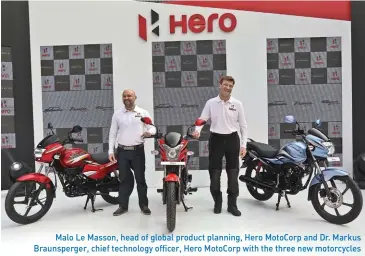  ??  ?? Malo Le Masson, head of global product planning, Hero MotoCorp and Dr. Markus Braunsperg­er, chief technology officer, Hero MotoCorp with the three new motorcycle­s