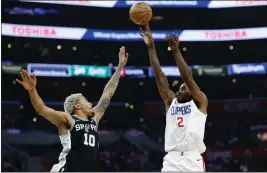  ?? KEVORK DJANSEZIAN — GETTY IMAGES ?? Kawhi Leonard of the Clippers puts up a shot over San Antonio's Jeremy Sochan in the first half of Sunday's game at Crypto.com Arena. Leonard posted a team-high 21points.