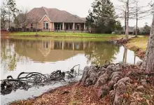  ?? Jason Fochtman/Staff photograph­er ?? The Woodlands will conduct its first analysis of its 68 ponds, including the one at Kayak Ridge Pond Park, in over 10 years.