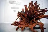  ??  ?? Chinese artist Ai Weiwei poses with his artworks at the Lisson Gallery in London as part of the Frieze Art week.