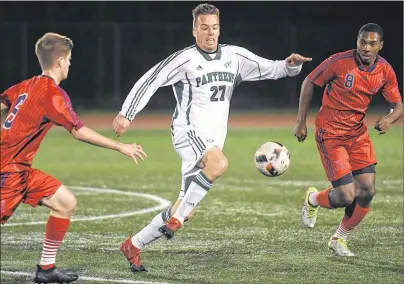  ?? VAUGHAN MERCHANT/CBU ATHLETICS ?? Lucas Ross of UPEI breaks between Sean Langille, left, and Ryan Parris of Acadia Axemen in quarter-final action of the Atlantic University Sport men’s soccer playoffs on the campus of CBU Thursday night.