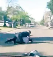  ?? KTLA ?? A VIDEO SHOWS a Sacramento officer repeatedly punching a man accused of jaywalking after the man challenged the officer’s reasons for stopping him.