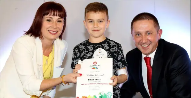  ??  ?? Callum Leonard from Bunscoil Loreto with Minister for Culture, Heritage & The Gaeltacht, Josepha Madigan and James Twohig, Director Ireland Operations at Valero.