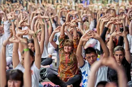  ?? Gustavo Garello/Associated Press ?? Attendants stretch Thursday during a Yoga for Peace event led by India’s Prime Minister Narendra Modi at La Rural Convention Center in Buenos Aires, Argentina.