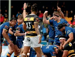  ?? GETTY IMAGES ?? Otago players celebrate a try during their successful Ranfurly Shield challenge against Taranaki last weekend.