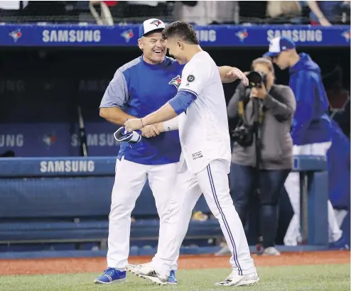  ?? GETTY IMAGES ?? Jays manager John Gibbons, seen with Aledmys Diaz, says he doesn’t worry about his job security.