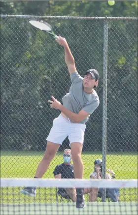  ?? PHOTO COURTESY OF SONIA SHEPPARD ?? Seaholm’s Johnny Cross serves during his No. 1 doubles match against Stoney Creek on Tuesday. Cross and teammate Brendan Lamb picked up a 6-2, 6-3 victory.