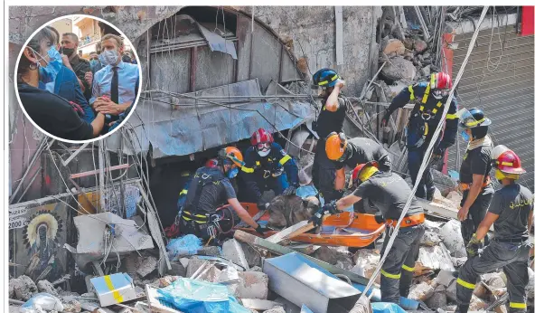  ?? Picture: AFP ?? The Lebanese civil defence use a dog to search for victims and survivors in the rubble and, inset, French President Emmanuel Macron meets the locals.