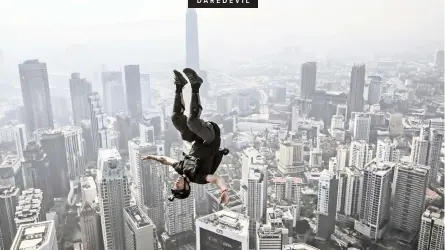  ?? EPA ?? A BASE jumper jumps from a 300m-high deck during the Kuala Lumpur Tower Internatio­nal Jump in Kuala Lumpur, Malaysia, yesterday. More than 140 BASE (Building, Antenna, Span and Earth) jumpers took part in the sport event. |