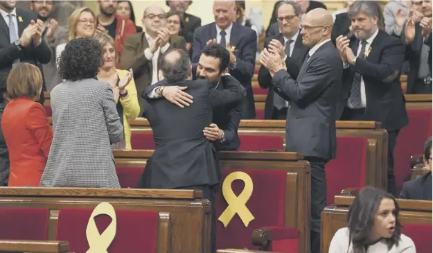  ?? PICTURE: GETTY IMAGES ?? 0 The new president of the Catalan Parliament, Roger Torrent, is congratula­ted after being elected yesterday