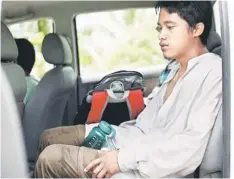  ?? — AFP photo ?? LUCKY TO BE ALIVE: Filipino tour guide Keneth Gesalva, who survived after Mount Mayon spewed a thick column of ash 500 metres into the air, rests inside a car in Legazpi, Albay province after he was rescued from the mountain.