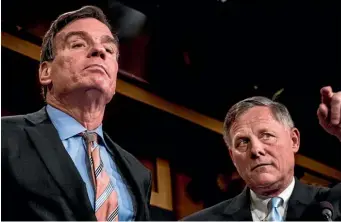  ?? WASHINGTON POST ?? Senate Intelligen­ce Committee vice chairman Mark Warner, left, and committee chairman Richard Burr, right, speak during a news conference on Capitol Hill.