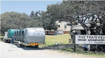  ?? Pictures: SIBONGILE NGALWA ?? DRY: Taps have run dry in Kei Mouth and The Thatches Holiday Accommodat­ion had to buy tanks to keep the business going as they expect an influx of holidaymak­ers into the small town. A sign notifies guests of the water shortage in Kei Mouth.