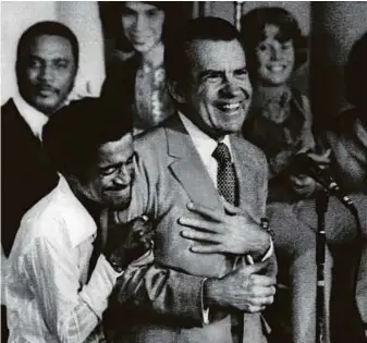  ?? Rex Features ?? Sammy Davis Jr embraces US President Richard Nixon at a youth rally during the US idDeanvit iaJrl ceammbrpaa­ceig nU. NPixroes n w w tN o ay t o e garalle rdieusr.ing