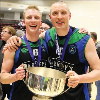  ??  ?? ABOVE: Warriors captain Darren O’Sullivan and Kieran Donaghy with the Champions Trophy. LEFT: MVP Paul Dick receives his award from Basketball Ireland President Teresa Walsh and CEO Bernard O’Byrne. Photo by Liam Ryan