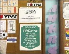  ?? MARCY DAVY VIA AP ?? This undated photo shows the "Welcome All" sign, center at bottom, created by Marcy Davy, on a classroom office door at the Early College Alliance on Eastern Michigan University's campus in Ypsilanti, Mich.