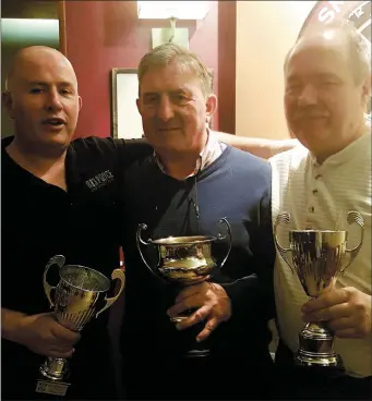  ??  ?? Johnny Palmer (Left) winner of the Clock House Cup dart tournament pictured with sponsor Noel Dinan and runner - up Klaus Richter (Right).