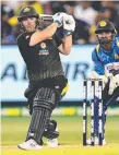  ?? Picture: AFP ?? Aaron Finch launches the ball over the boundary.