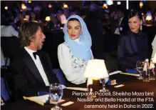  ?? ?? Pierpaolo Piccioli, Sheikha Moza bint Nasser and Bella Hadid at the FTA ceremony held in Doha in 2022.